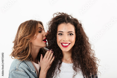 Close up image of smiling curly girl looking at camera