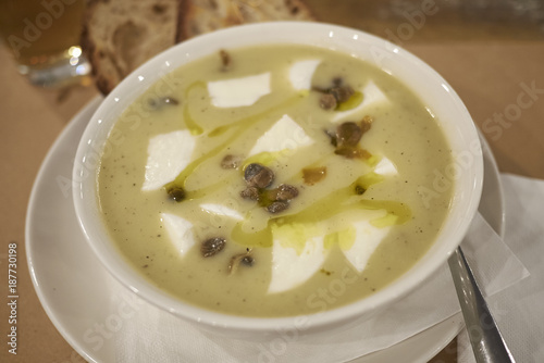 Potato soup with burrata cheese and capers