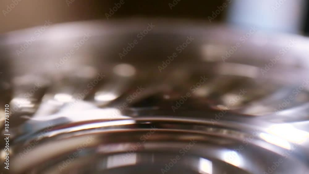 Water drop falling into in a bowl close-up, Water drop falling into in a bowl close-up,