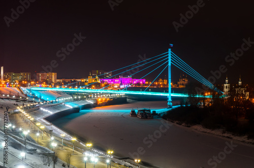 Night view of pedestrian bridge over the Tura river in Tyumen