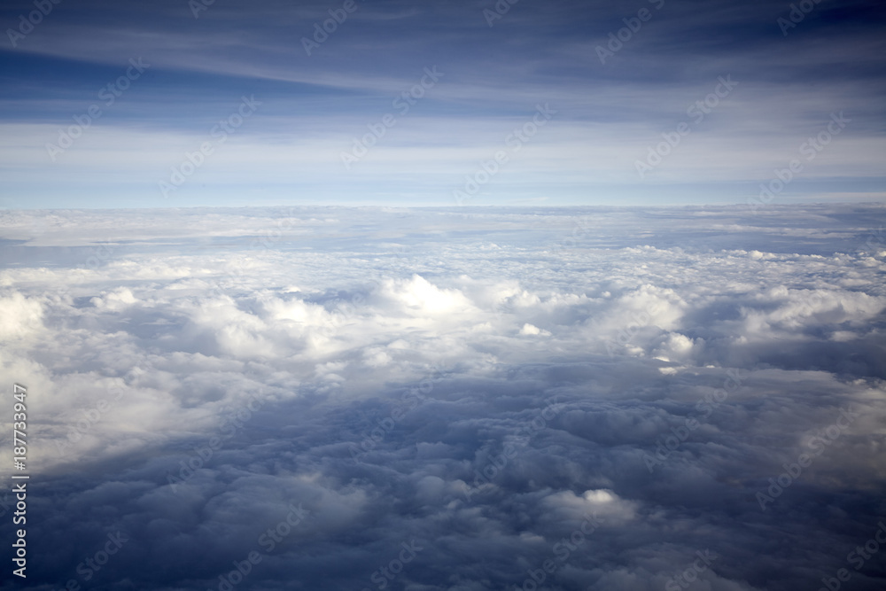 flying high in a blue sky with white clouds and sun shine flying high in a blue sky with white clouds and sun shine