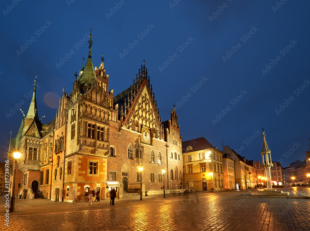 Market square and Town Hall in Wroclaw, Poland, on a rainy night