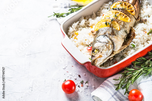 Fish seabass baked with rice and vegetables.