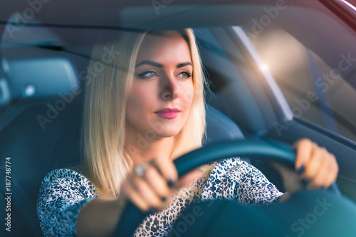 Young woman driving a car