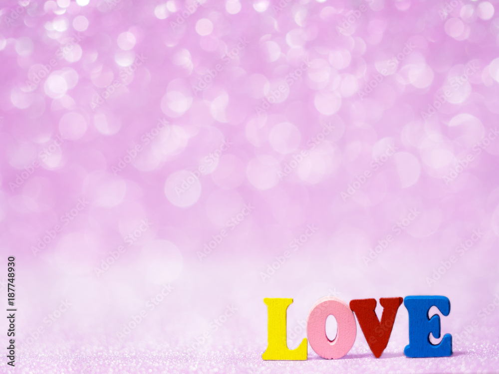 LOVE text on pink abstract glitter background with bokeh. lights blurry soft pink for the romance background and background copy space for text. Valentines day, love concept and love background