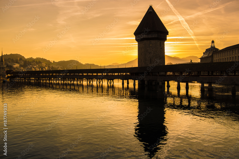 The Kapellbrücke (Chapel Bridge), a covered wooden footbridge spanning diagonally across the Reuss in the city of Lucerne in central Switzerland.