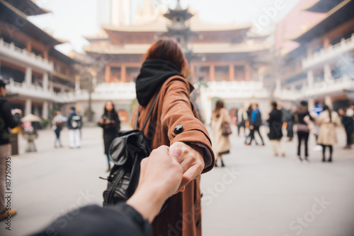 Photography Woman in jacket clothes leading man to the temple in shanghai
