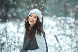 beautiful smiling young woman in wintertime outdoor. Winter concept