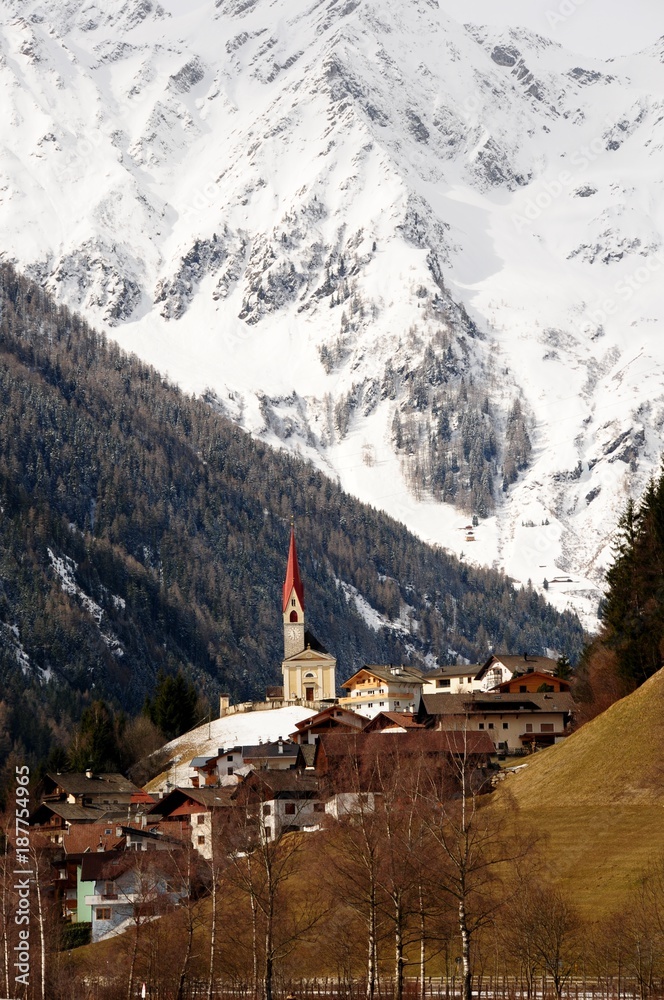 The Church of Lappago in the italian Dolomites. Winter season, Val Pusteria. Italy.