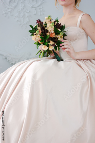 Woman in beautiful dress ho...