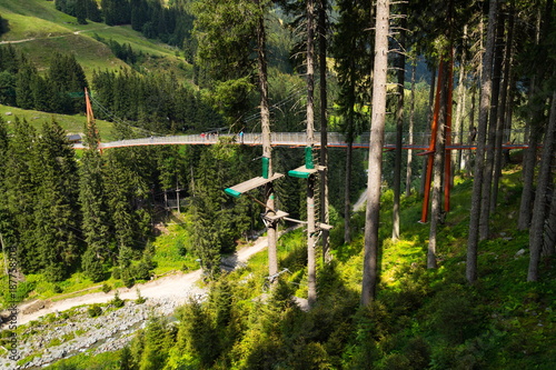 Alpine Golden Gate suspension bridge in Saalbach-Hinterglemm valley, Alps, Austria