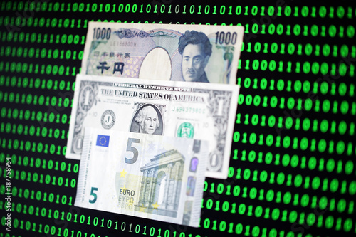 japanese yen,us dollar and euro notebank among binary code background photo