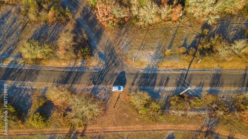 A countryside road from above, in a morning winter light