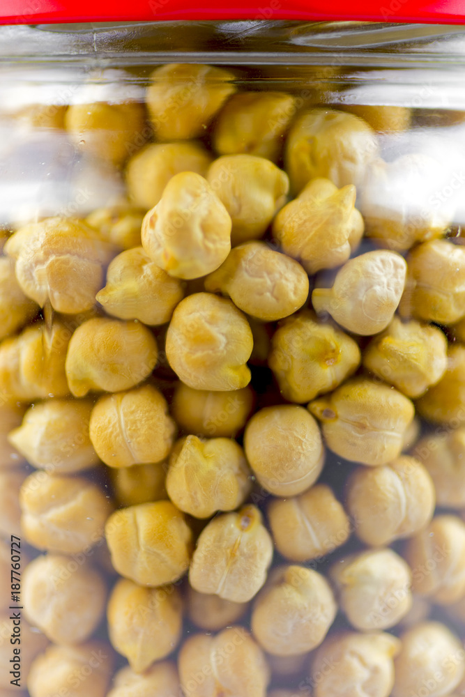 Chickpeas in a glass jar closeup Chickpeas in a glass jar closeup