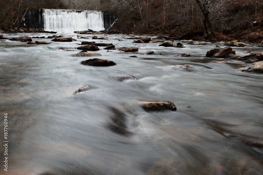 Water Cascading over and through a stone wall. Water Cascading over and through a stone wall.