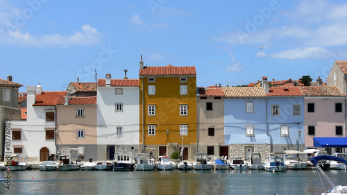 Colorful houses as seen from the sea in little town Cres, Croatia