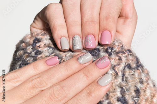 Wallpaper Mural Closeup view of white hands of woman with beautiful modern grey and pink manicure design. Horizontal color photography. Torontodigital.ca