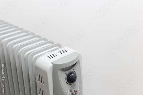 View from above at oil electric radiator heater on white background