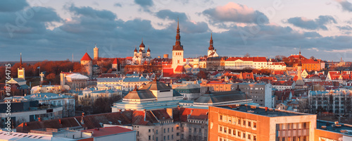 Aerial panoramic cityscape with Medieval Old Town with Saint Nicholas Church, Cathedral Church of Saint Mary and Alexander Nevsky Cathedral in Tallinn at sunset, Estonia