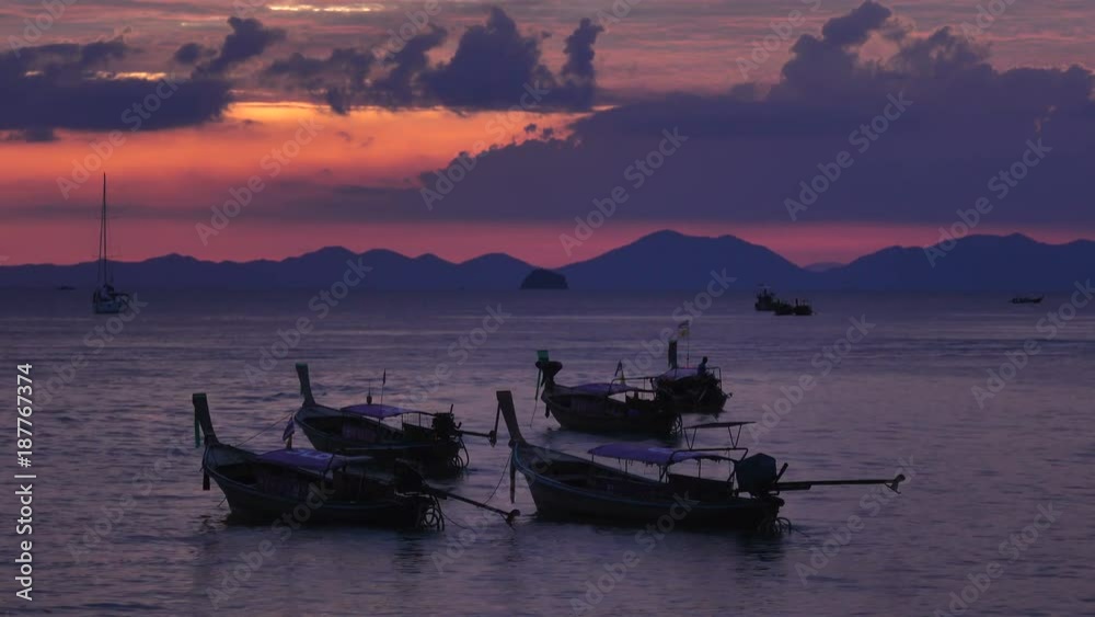Group of long tail boats in the Andaman sea at purple sunset. Thailand Group of long tail boats in the Andaman sea at purple sunset. Thailand
