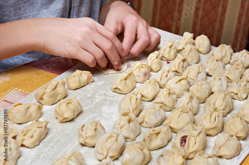 Making homemade dumplings with minced meat