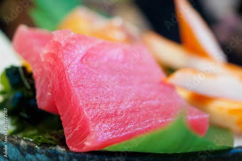 Sashimi set on ice with salmon tuna with chopsticks