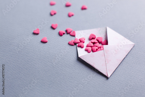 Valentines day love letter. opened envelope and many felt pink hearts. Empty copy space © misskaterina