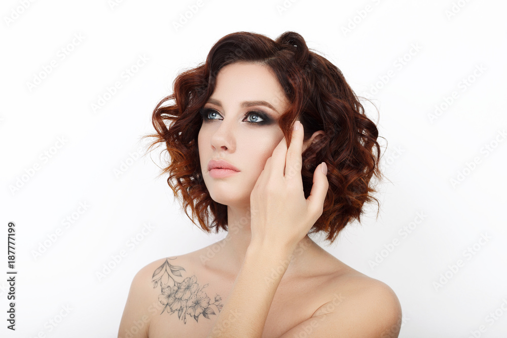 Close up beauty studio shot of beautiful redhead woman with gorgeous makeup curly hair Close up beauty studio shot of beautiful redhead woman with gorgeous makeup curly hair