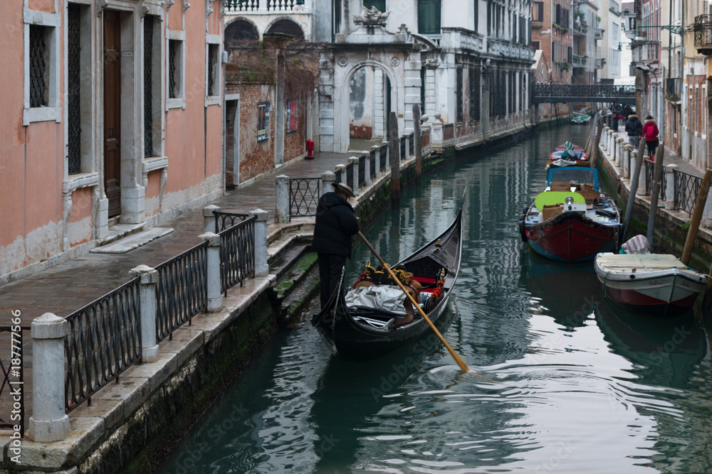 Gondola ride in Venice canal , Italy