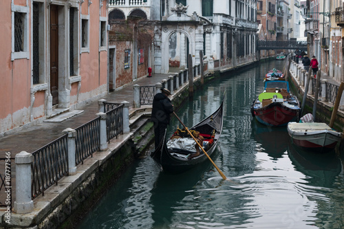 Gondola ride in Venice canal , Italy