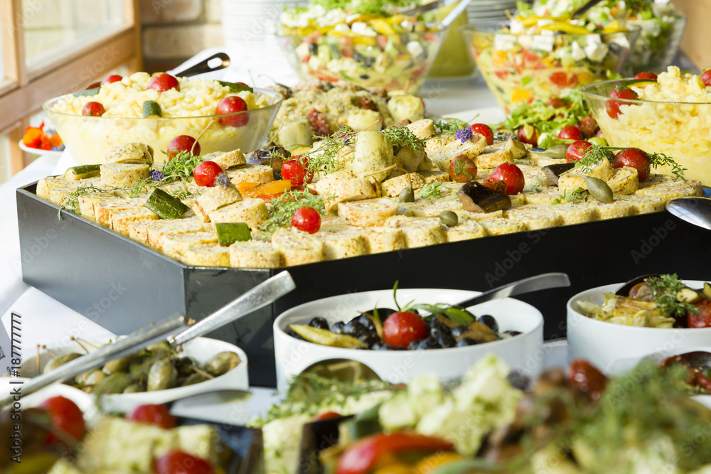 Buffet mit Lachsröllchen, Salate, Antipasti Stock-Foto | Adobe Stock