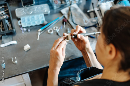 The girl is engaged in jewelry business