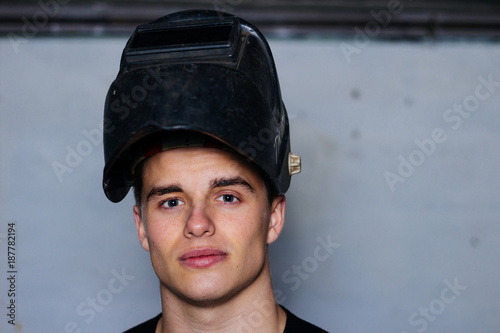 Close up portrait of handsome welder.