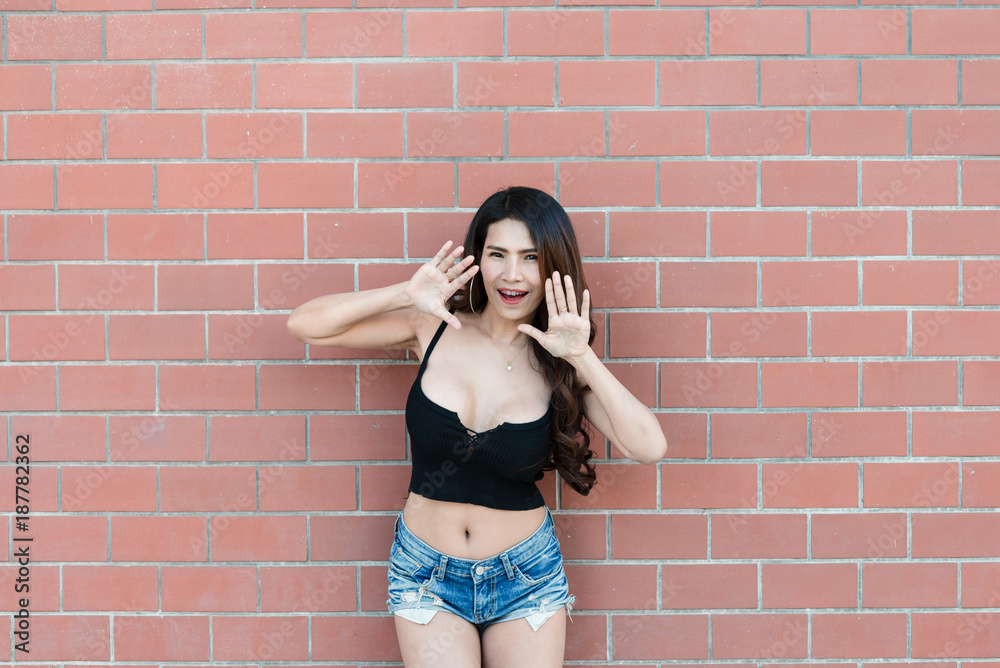 Portrait of beautiful asian woman  on brick wall background,Thailand people