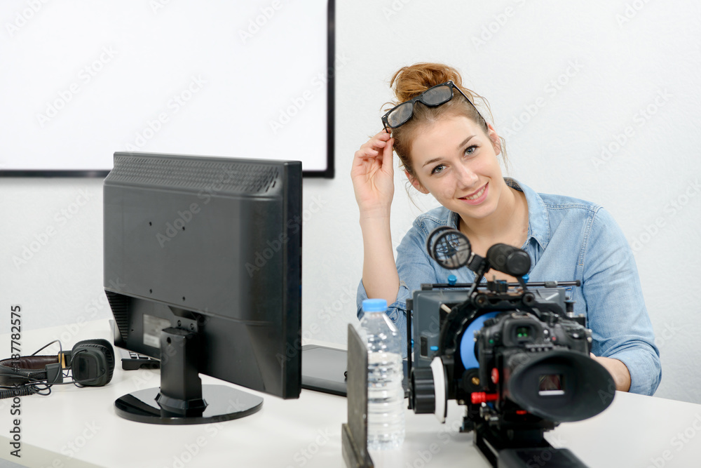 young woman using computer for video editing