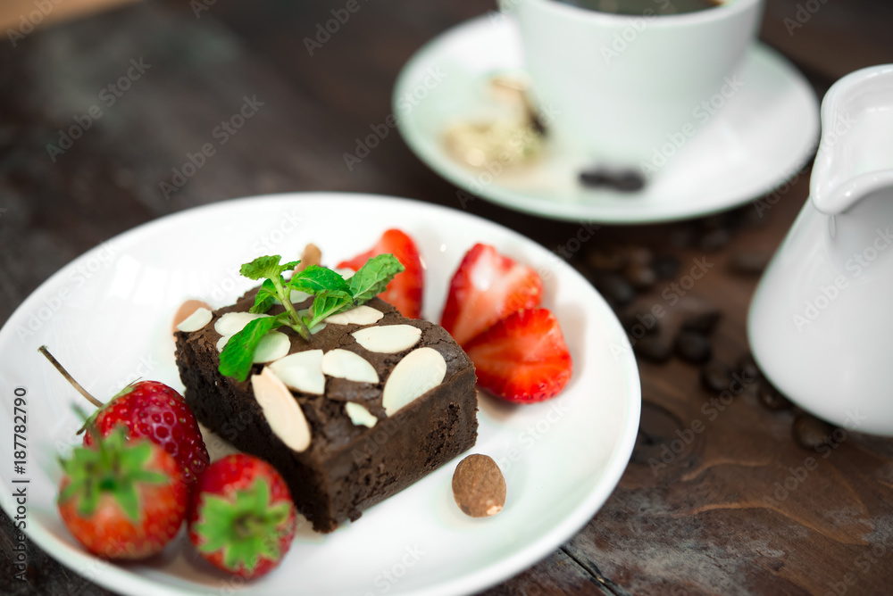Brownie with Fresh strawberry on white plate