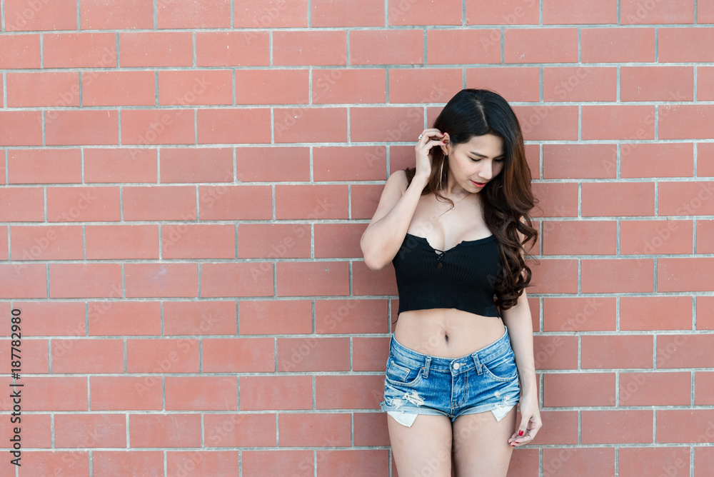 Portrait of beautiful asian woman  on brick wall background,Thailand people