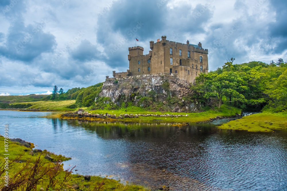 Dunvegan Castle on the Isle of Skye, Highlands of of Scotland. Seat of the MacLeod Clan. Built on an elevated rock overlooking Loch Dunvegan.