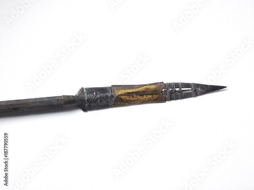 Antique silver and gold colour spear head, white background