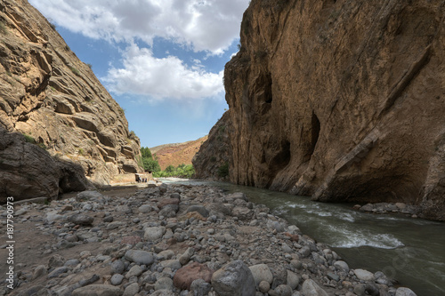 Mountain gorge with a river and blue sky