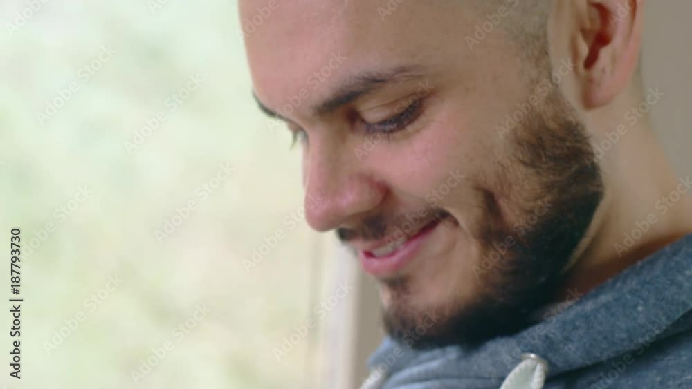 Close-up of hispanic man in bright morning space processing mobile payment on smartphone Close-up of hispanic man in bright morning space processing mobile payment on smartphone