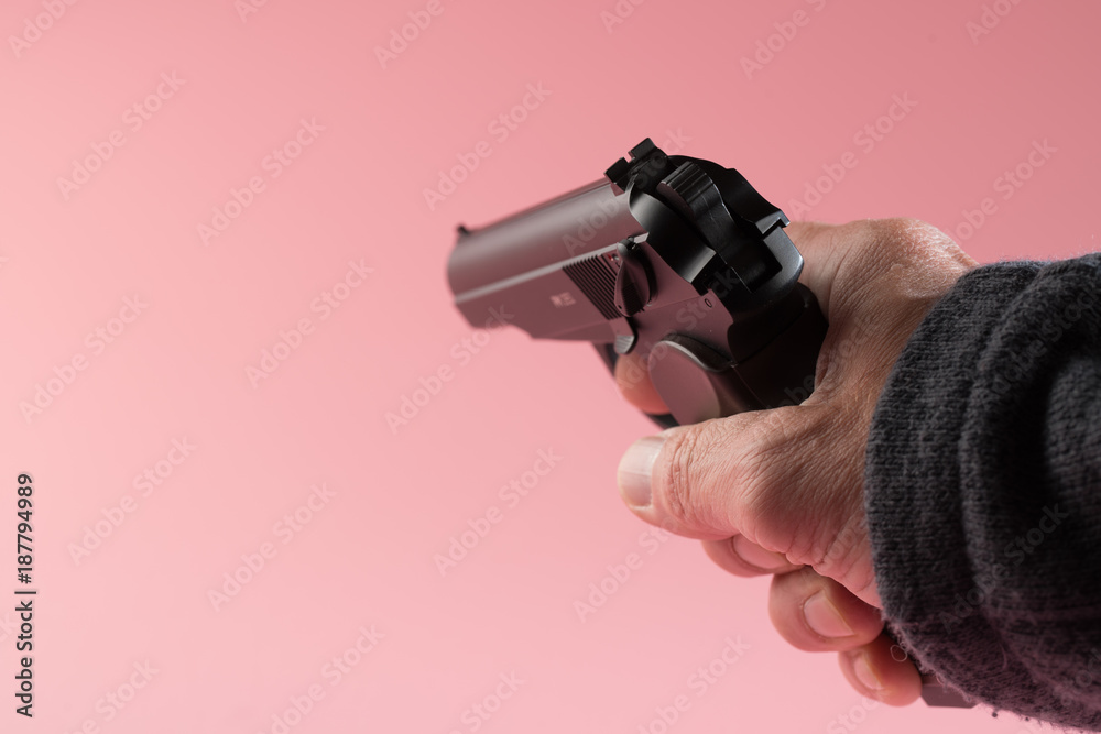 Fototapeta premium Male hand with gun