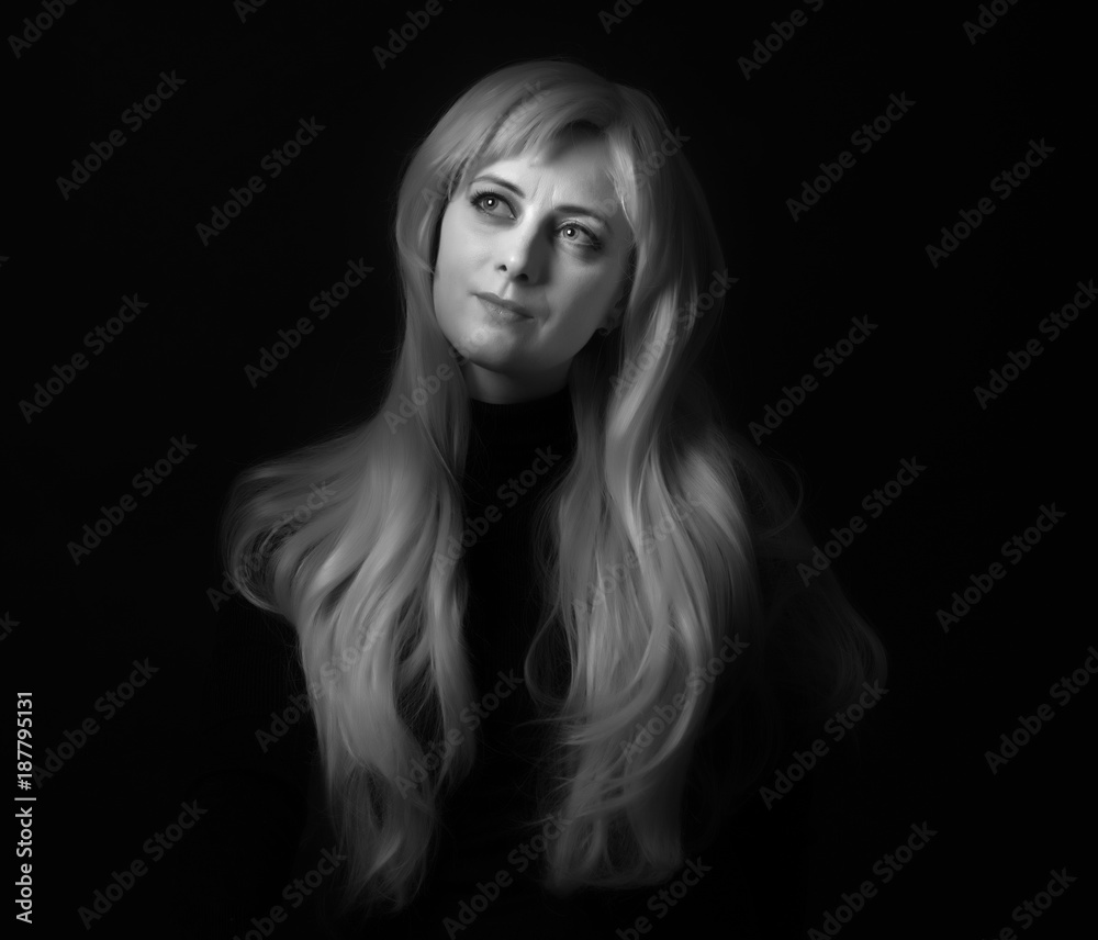 Photo shooting indoors. On a black background. A woman with long white hair, wearing a black jacket.
Photo shooting indoors. On a black background. A woman with long white hair, wearing a black jacket.