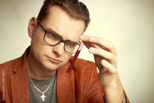 Drug dealer watching drugs in test tube for quality proof photo