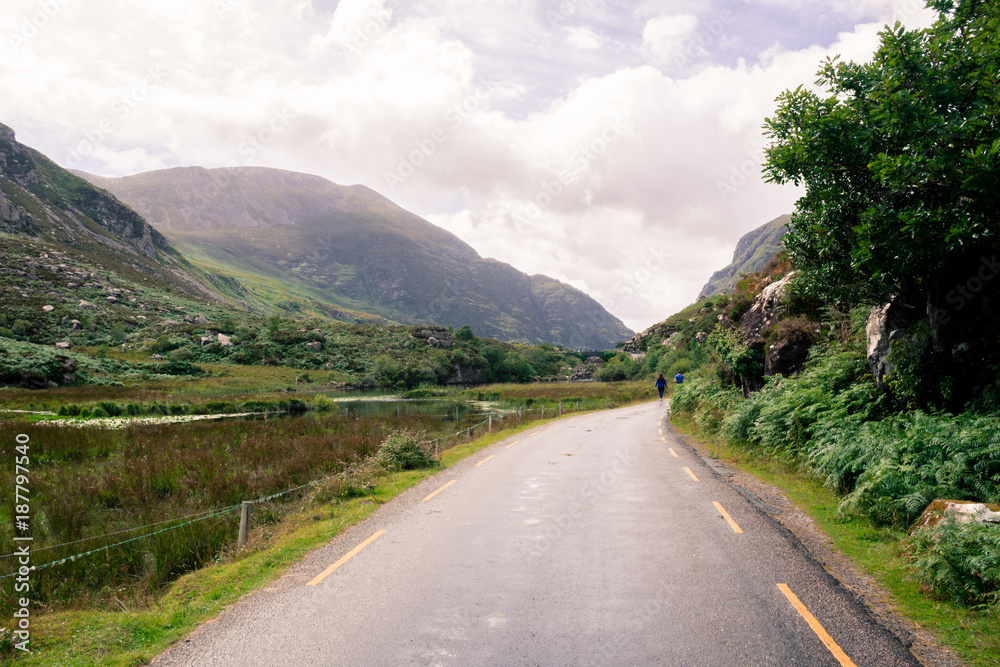 GAP OF DUNLOE, IRELAND - JUL 27, 2017: The Gap of Dunloe is a narrow mountain pass forged between the MacGillycuddy Reeks and Purple Mountain by glacial flows.