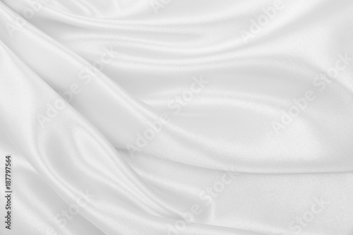 Smooth elegant white silk or satin luxury cloth texture as wedding background. Luxurious Christmas background or New Year background design