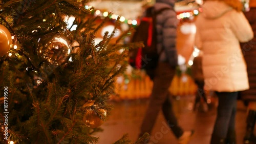 4K Christmas bell decoration and fair in the background