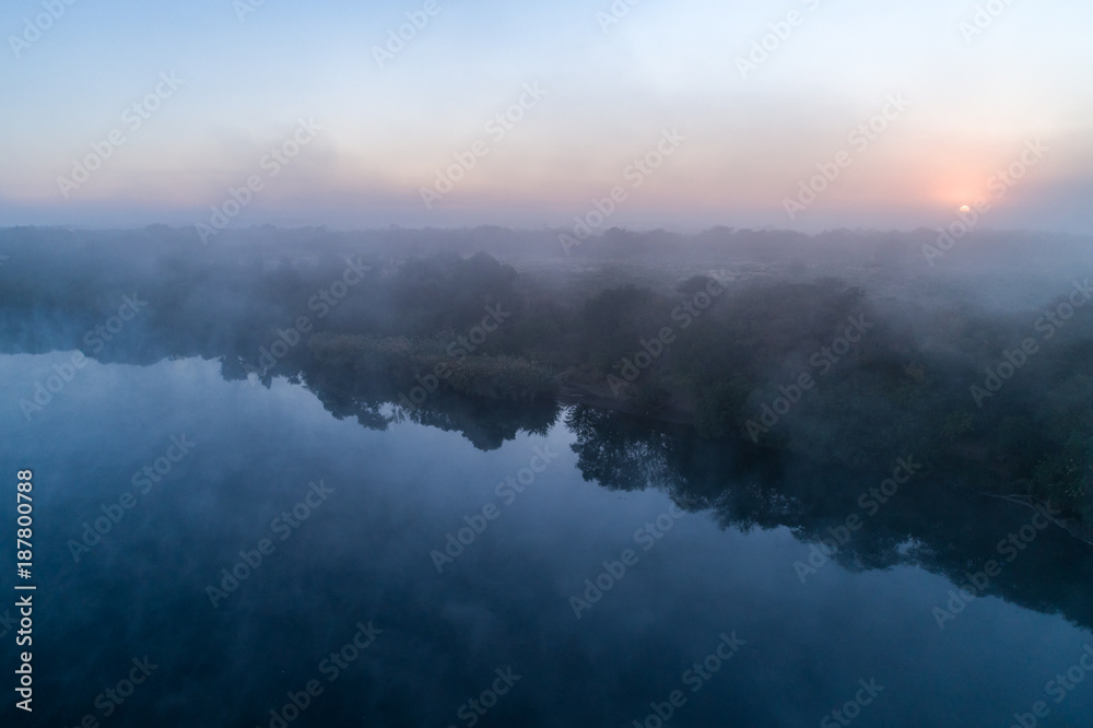Aerial view of the Okavango River at dawn, Angola Aerial view of the Okavango River at dawn, Angola