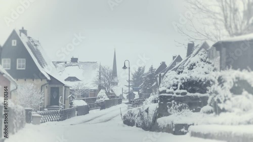 Snowy street of mountain town, village snow calamity. Winter landscape with falling snow. Everything is covered, fresh powder. Intense atmosphere like Nordic detectives. Winter Christmas background.