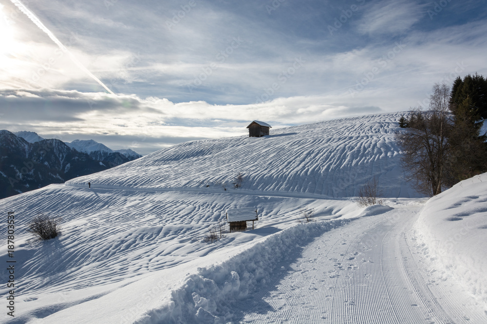 Wooden alpine hut in ski resort Serfaus Fiss Ladis in Austria with snowy mountains Wooden alpine hut in ski resort Serfaus Fiss Ladis in Austria with snowy mountains